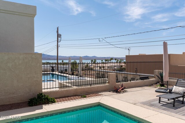 view of swimming pool with a patio area, a fenced backyard, and a fenced in pool