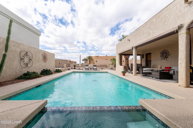 view of pool featuring an outdoor hangout area, a patio area, and a pool with connected hot tub