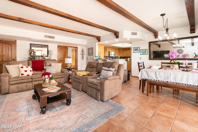 living area featuring a chandelier, beam ceiling, light tile patterned flooring, and visible vents