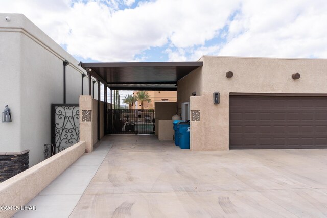 exterior space featuring a gate and driveway