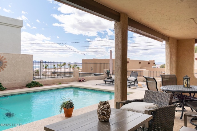 view of pool featuring a fenced in pool, a patio, and fence