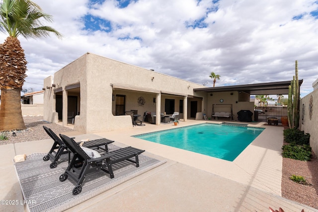 view of pool featuring a fenced in pool, fence private yard, and a patio area