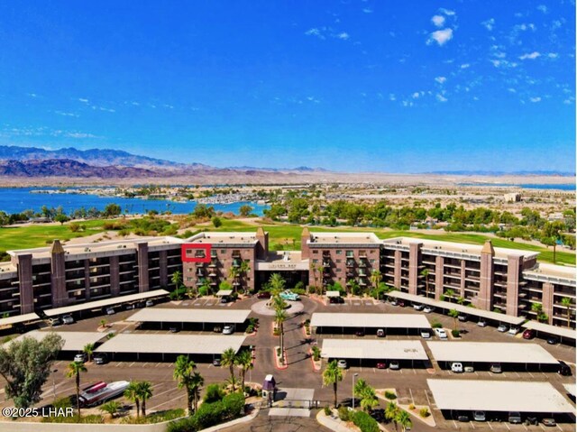 birds eye view of property with a mountain view