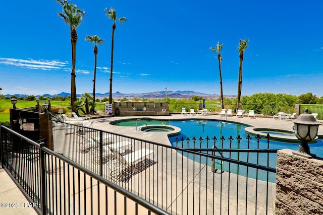777 Harrah Way Unit 524, Lake Havasu City, AZ 86403 - view of pool featuring a hot tub, a mountain view, and a patio