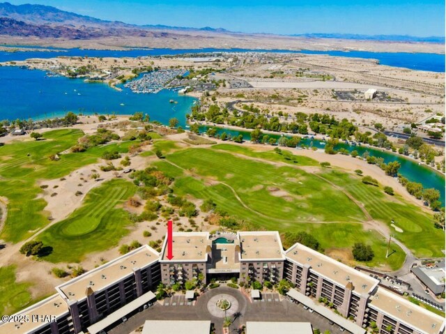 drone / aerial view featuring a water and mountain view