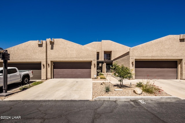 southwest-style home featuring a garage