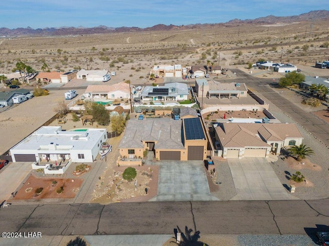 birds eye view of property featuring a mountain view