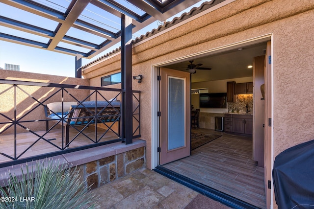 entrance to property featuring a pergola