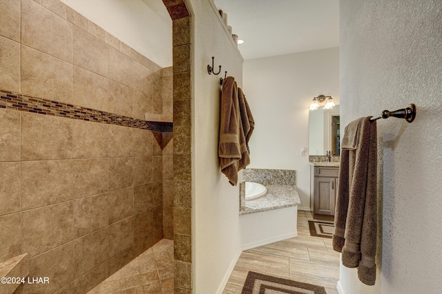 bathroom featuring vanity and a tile shower