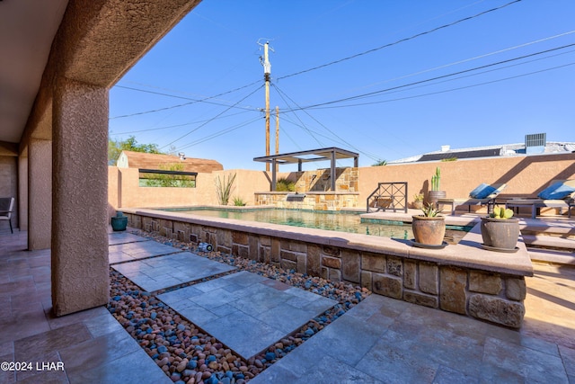 view of patio / terrace with a fenced in pool