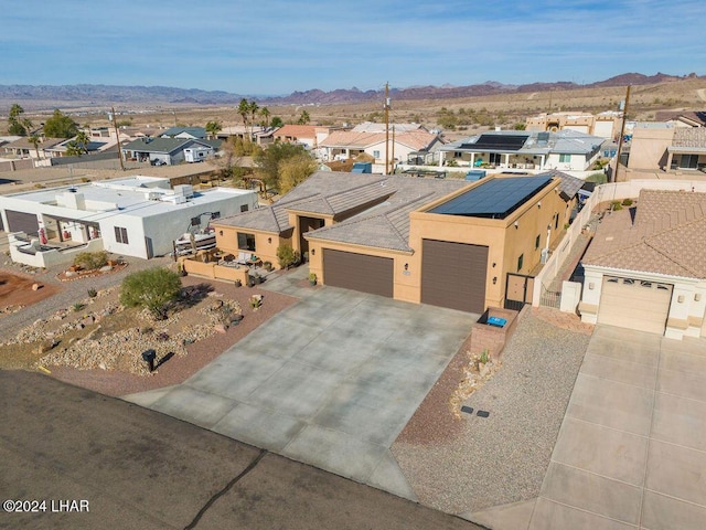 birds eye view of property with a mountain view