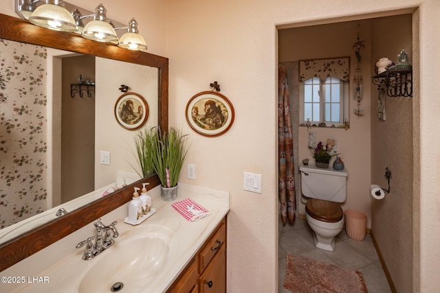 full bath featuring tile patterned flooring, vanity, and toilet
