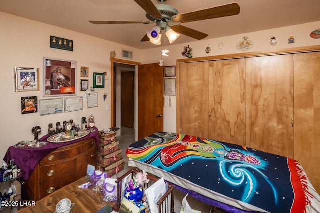 bedroom with visible vents, a closet, and a ceiling fan