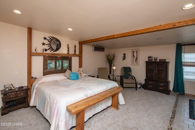 bedroom featuring recessed lighting, light colored carpet, and a wall unit AC