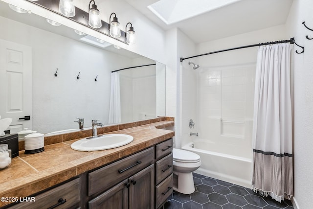1921 Burgundy Ln, Lake Havasu City, AZ 86404 - bathroom with toilet, a skylight, shower / tub combo, tile patterned flooring, and vanity