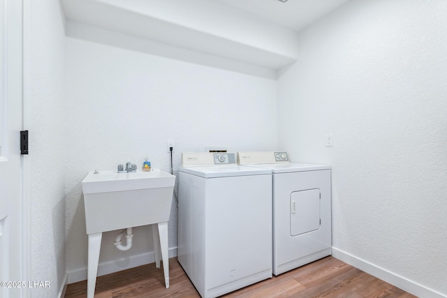 1921 Burgundy Ln, Lake Havasu City, AZ 86404 - laundry room featuring light wood-style floors, washer and clothes dryer, baseboards, and laundry area