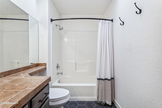 1921 Burgundy Ln, Lake Havasu City, AZ 86404 - full bathroom featuring shower / bath combo, toilet, a textured wall, and tile patterned flooring