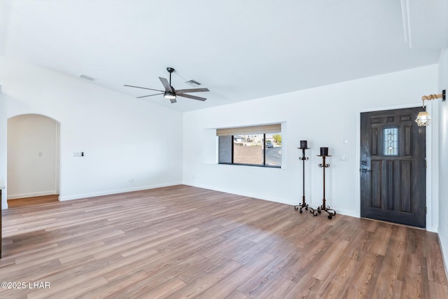 1921 Burgundy Ln, Lake Havasu City, AZ 86404 - interior space featuring arched walkways, light wood-type flooring, visible vents, and a ceiling fan