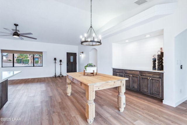 1921 Burgundy Ln, Lake Havasu City, AZ 86404 - dining space featuring baseboards, ceiling fan with notable chandelier, visible vents, and light wood-type flooring