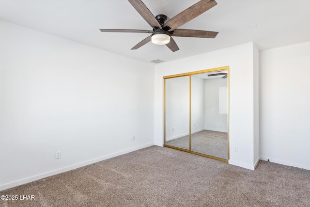 1921 Burgundy Ln, Lake Havasu City, AZ 86404 - unfurnished bedroom featuring carpet flooring, visible vents, baseboards, a ceiling fan, and a closet