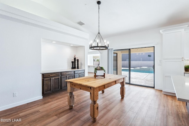 1921 Burgundy Ln, Lake Havasu City, AZ 86404 - playroom featuring light wood finished floors, baseboards, an inviting chandelier, and visible vents