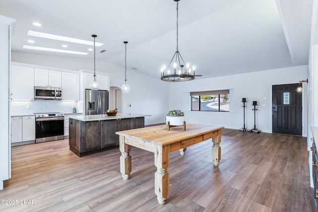 1921 Burgundy Ln, Lake Havasu City, AZ 86404 - playroom featuring a chandelier, lofted ceiling, light wood-type flooring, and recessed lighting