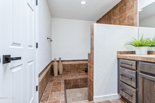 1921 Burgundy Ln, Lake Havasu City, AZ 86404 - bathroom with tile walls, walk in shower, vanity, and recessed lighting