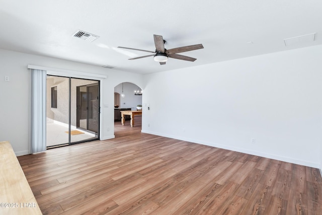 1921 Burgundy Ln, Lake Havasu City, AZ 86404 - interior space with light wood finished floors, visible vents, arched walkways, and ceiling fan