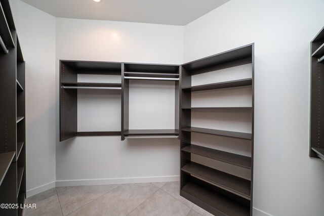 spacious closet featuring tile patterned floors