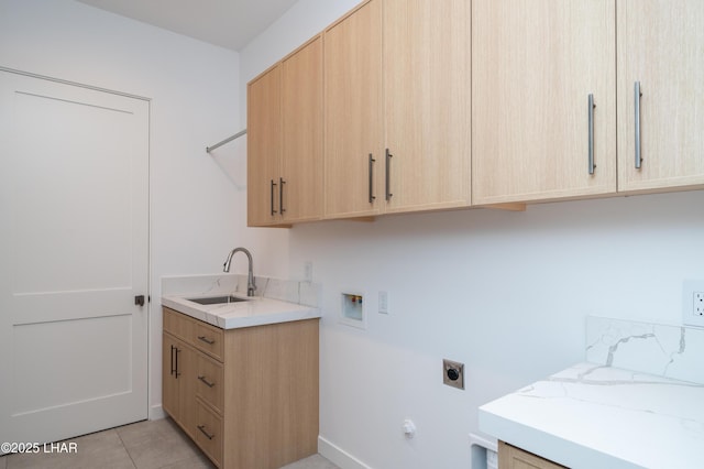 laundry room with hookup for a washing machine, light tile patterned flooring, cabinet space, a sink, and electric dryer hookup