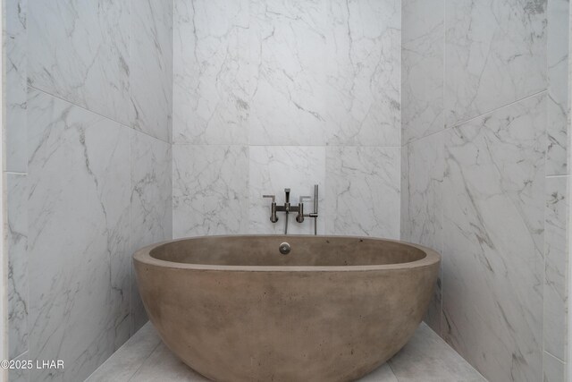 full bath with a freestanding tub