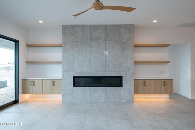 unfurnished living room with recessed lighting, a fireplace, visible vents, and ceiling fan