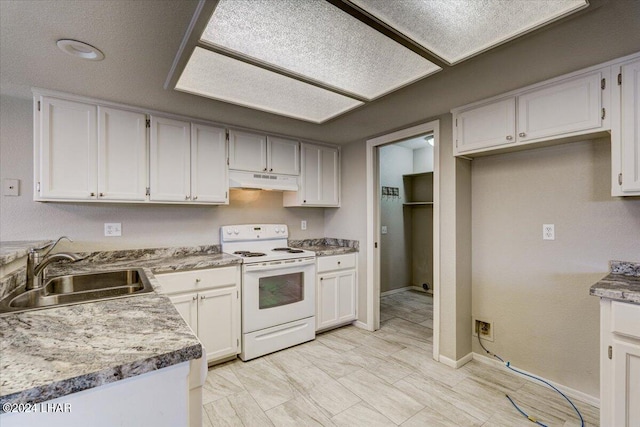 kitchen with electric stove, sink, and white cabinetry