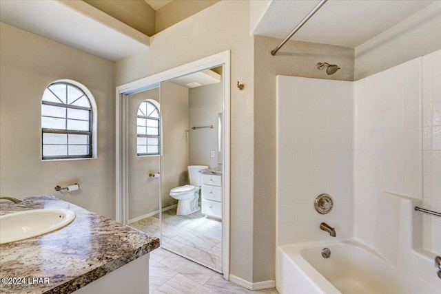 full bathroom featuring vanity,  shower combination, and toilet