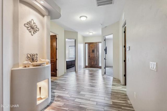 hallway featuring light hardwood / wood-style flooring