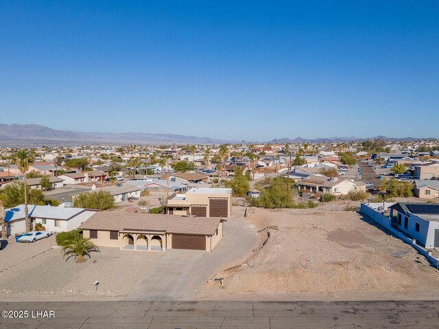 birds eye view of property featuring a mountain view