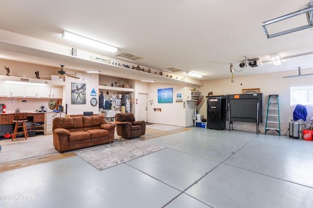 garage featuring visible vents and a garage door opener