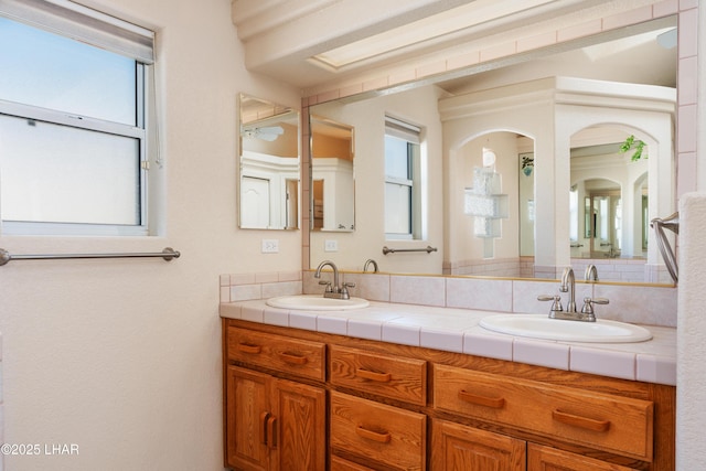 bathroom with double vanity and a sink