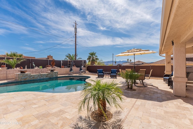 view of pool with fence, a fenced in pool, and a patio