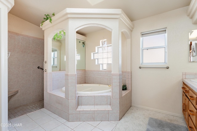 bathroom with tile patterned floors, a walk in shower, vanity, and a bath