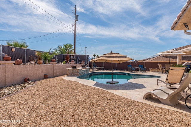 view of swimming pool with a fenced in pool, a patio area, and a fenced backyard