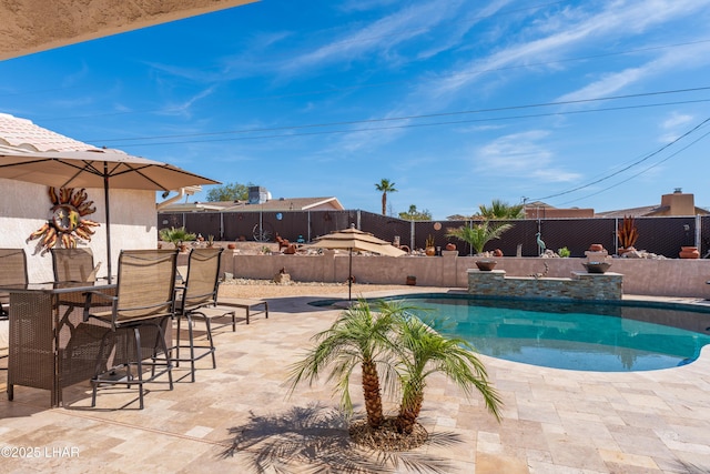 view of swimming pool featuring a patio area, a fenced backyard, and a fenced in pool