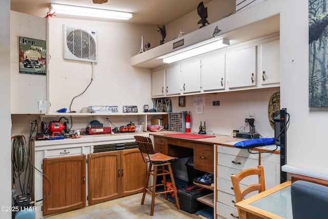 kitchen featuring white cabinets, light countertops, and concrete floors