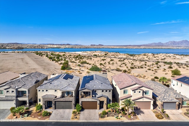 bird's eye view with a water and mountain view