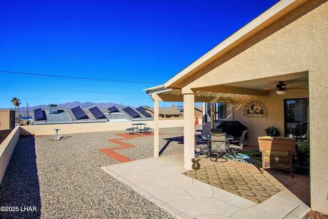 view of patio / terrace featuring ceiling fan and grilling area