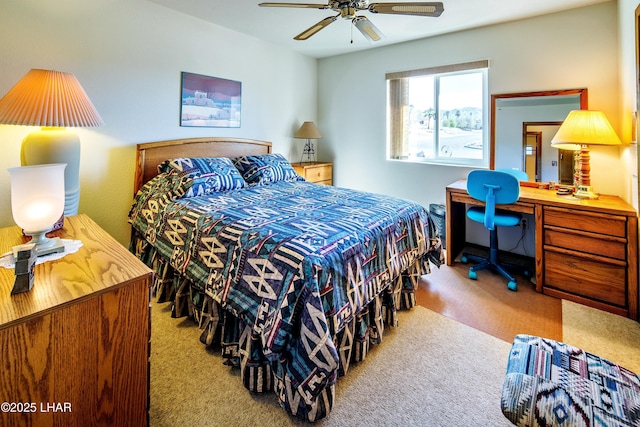 bedroom featuring ceiling fan and light carpet