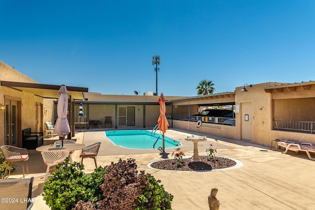 view of pool with a patio area