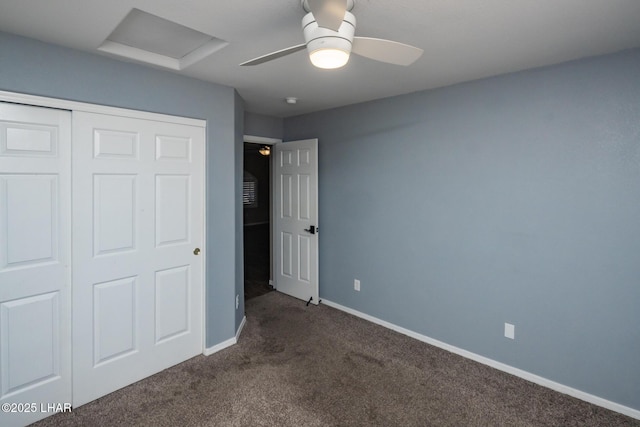 679 Apache Dr, Lake Havasu City, AZ 86406 - unfurnished bedroom featuring attic access, dark carpet, a closet, and a ceiling fan