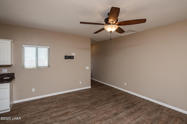 679 Apache Dr, Lake Havasu City, AZ 86406 - empty room featuring a ceiling fan and dark wood-style floors