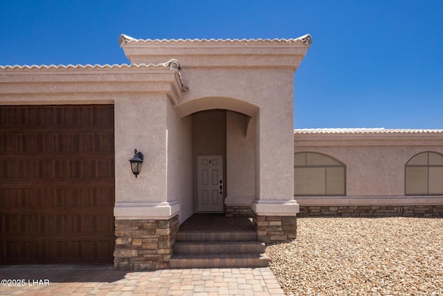 679 Apache Dr, Lake Havasu City, AZ 86406 - entrance to property featuring stone siding, stucco siding, and a garage